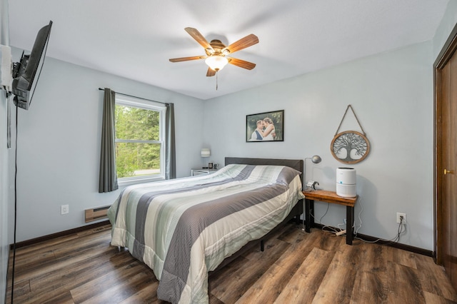 3108 4th Ave, Grand Rapids, MN 55744 - bedroom with a baseboard heating unit, wood finished floors, baseboards, and ceiling fan