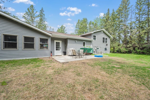 3108 4th Ave, Grand Rapids, MN 55744 - rear view of property featuring a patio area and a lawn