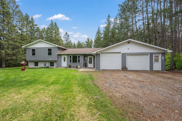 3108 4th Ave, Grand Rapids, MN 55744 - tri-level home featuring dirt driveway, a front lawn, and a garage