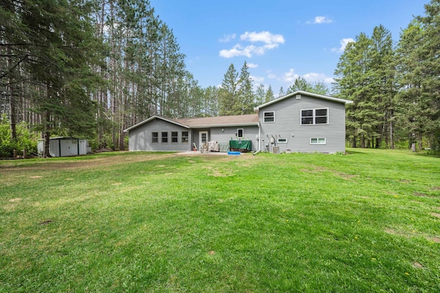 3108 4th Ave, Grand Rapids, MN 55744 - back of house featuring a yard and a patio