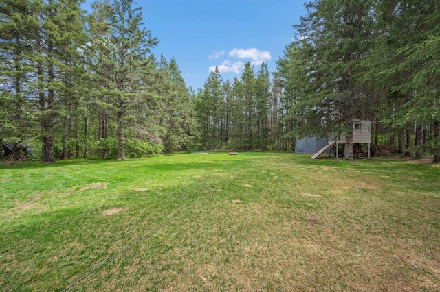 3108 4th Ave, Grand Rapids, MN 55744 - view of green lawn with a forest view