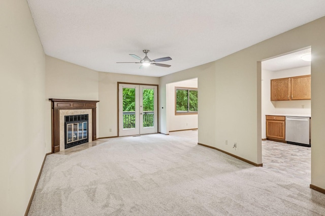10726 Toledo Ct, Bloomington, MN 55437 - unfurnished living room featuring ceiling fan, light carpet, baseboards, and a high end fireplace
