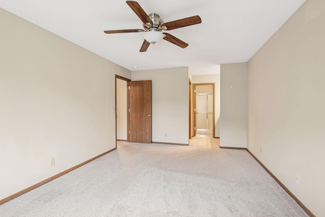10726 Toledo Ct, Bloomington, MN 55437 - unfurnished bedroom featuring light colored carpet, baseboards, and ceiling fan
