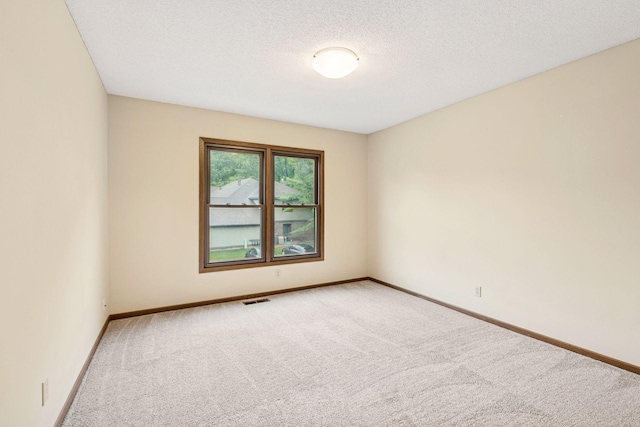 10726 Toledo Ct, Bloomington, MN 55437 - carpeted empty room with baseboards and a textured ceiling