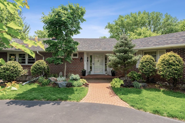 6413 Mendelssohn Ln, Edina, MN 55343 - ranch-style home with brick siding, a shingled roof, and a front yard