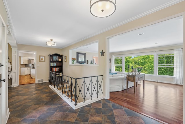 6413 Mendelssohn Ln, Edina, MN 55343 - hallway featuring stone finish flooring, ornamental molding, an upstairs landing, and baseboards