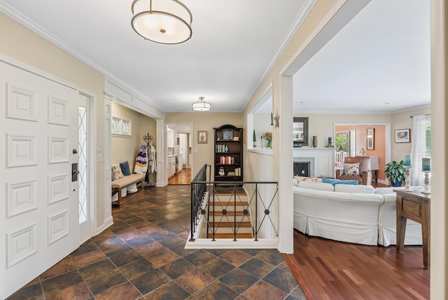 6413 Mendelssohn Ln, Edina, MN 55343 - entrance foyer with a fireplace, ornamental molding, and baseboards