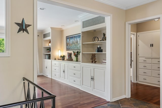 6413 Mendelssohn Ln, Edina, MN 55343 - corridor featuring built in features, ornamental molding, baseboards, and dark wood-style flooring