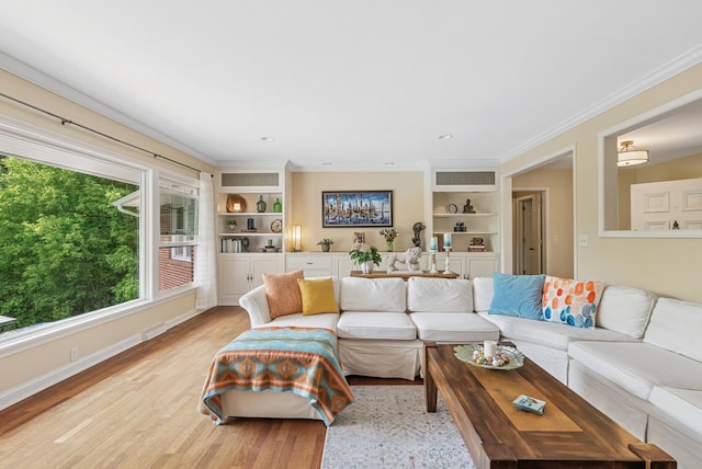 6413 Mendelssohn Ln, Edina, MN 55343 - living room featuring built in features, ornamental molding, and light wood finished floors