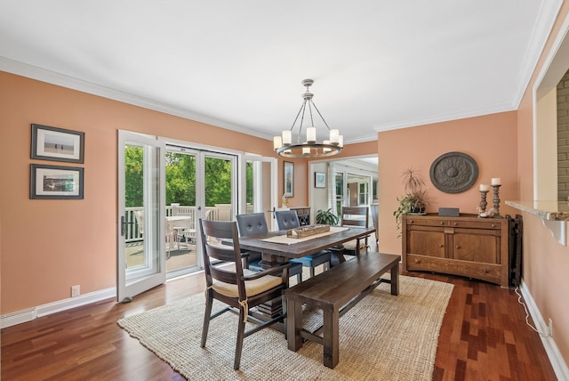 6413 Mendelssohn Ln, Edina, MN 55343 - dining space featuring a chandelier, crown molding, dark wood finished floors, baseboards, and french doors