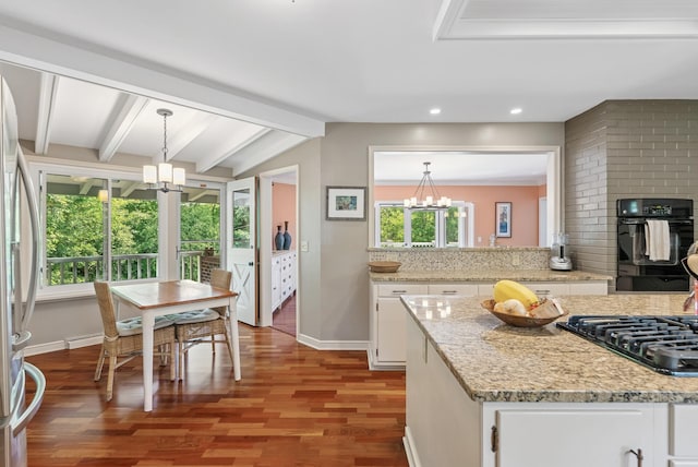 6413 Mendelssohn Ln, Edina, MN 55343 - kitchen with a chandelier, black appliances, white cabinetry, and recessed lighting