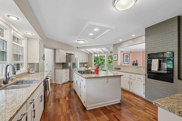 6413 Mendelssohn Ln, Edina, MN 55343 - kitchen featuring a sink, stainless steel appliances, dark wood-style flooring, white cabinets, and recessed lighting