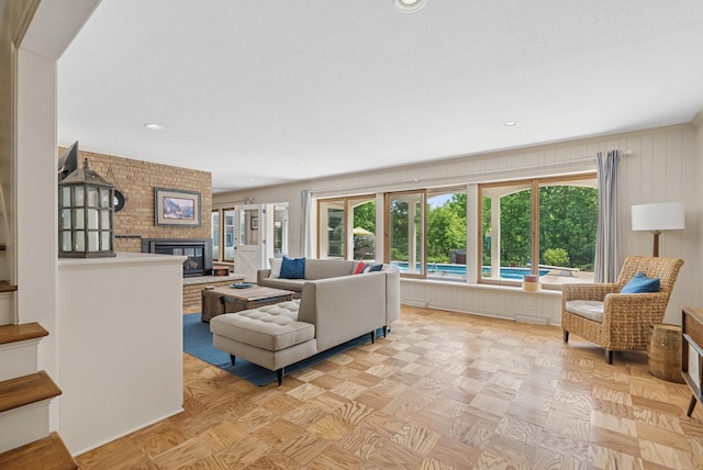 6413 Mendelssohn Ln, Edina, MN 55343 - living area featuring plenty of natural light, a brick fireplace, and recessed lighting