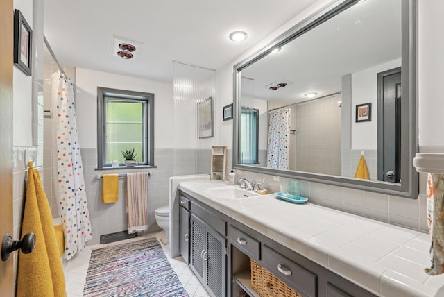 6413 Mendelssohn Ln, Edina, MN 55343 - full bathroom featuring tile patterned flooring, toilet, tile walls, vanity, and a shower with curtain