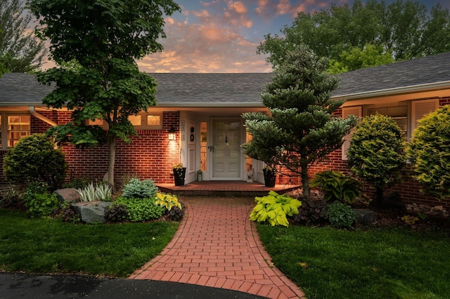 6413 Mendelssohn Ln, Edina, MN 55343 - view of front of property featuring brick siding, a yard, and roof with shingles