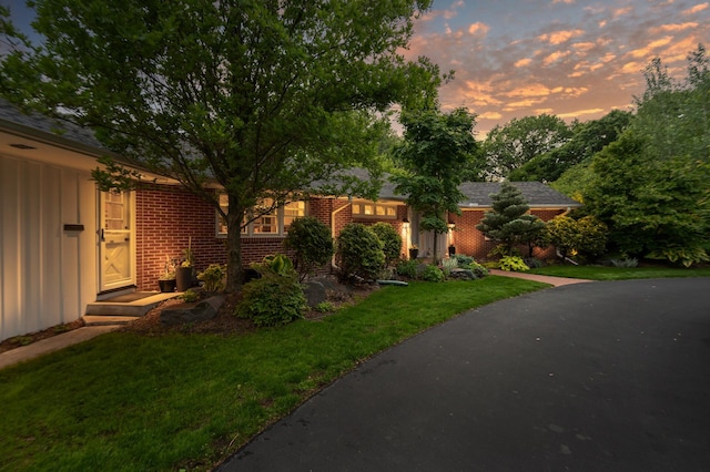 6413 Mendelssohn Ln, Edina, MN 55343 - ranch-style home featuring brick siding, a lawn, and board and batten siding