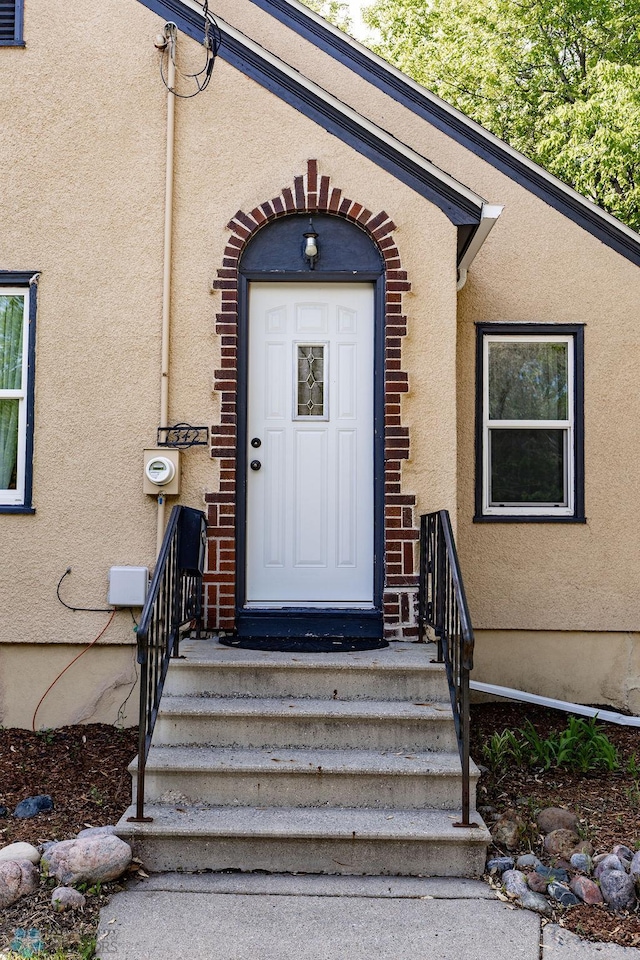 1342 10th St N, Fargo, ND 58102 - doorway to property with stucco siding