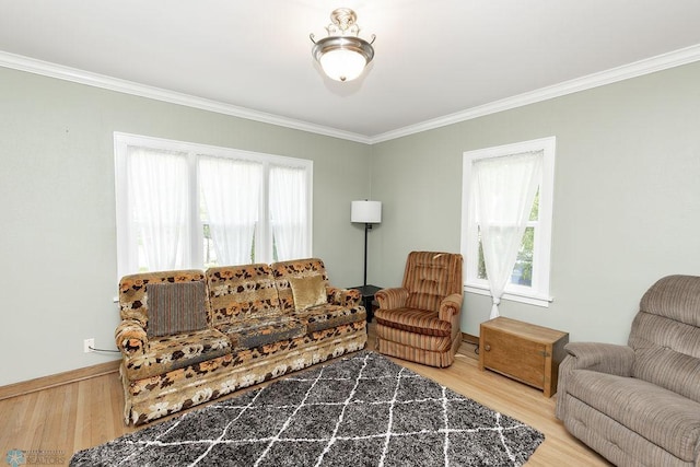 1342 10th St N, Fargo, ND 58102 - living room featuring ornamental molding, wood finished floors, plenty of natural light, and baseboards