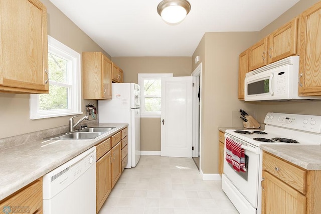 1342 10th St N, Fargo, ND 58102 - kitchen with white appliances, a sink, and light brown cabinets