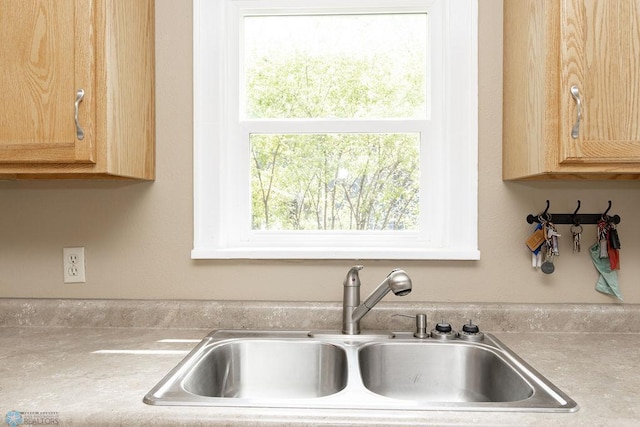 1342 10th St N, Fargo, ND 58102 - kitchen featuring a sink, light countertops, and light brown cabinets