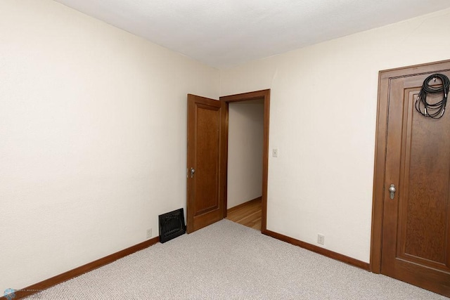 1342 10th St N, Fargo, ND 58102 - spare room featuring carpet and baseboards