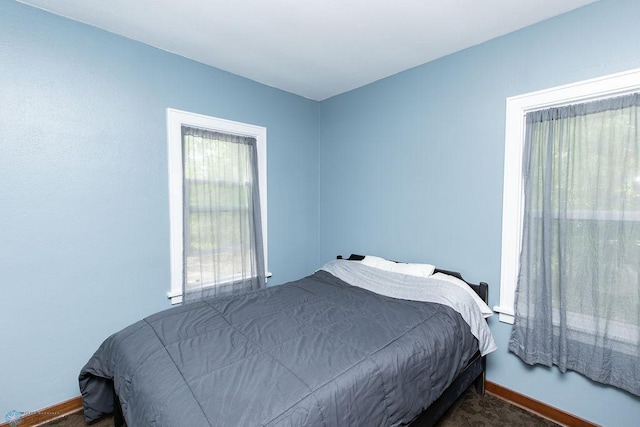 1342 10th St N, Fargo, ND 58102 - bedroom featuring baseboards and dark colored carpet