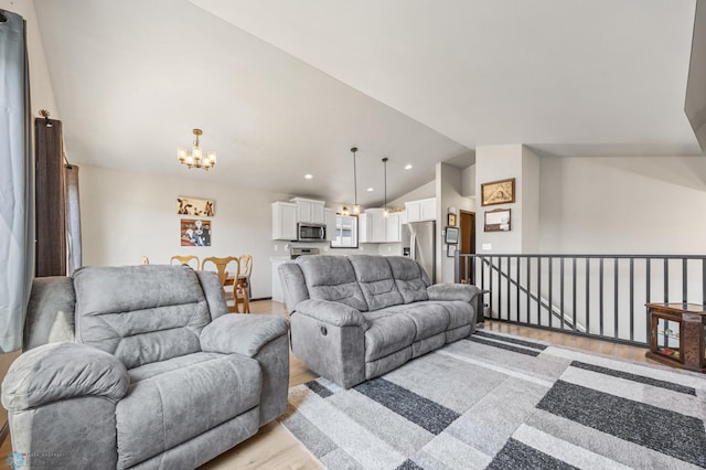 6718 69th Ave S, Horace, ND 58047 - living room with light wood-style flooring, vaulted ceiling, a chandelier, and recessed lighting