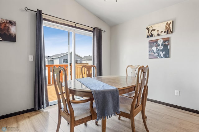 6718 69th Ave S, Horace, ND 58047 - dining room featuring vaulted ceiling, light wood finished floors, and baseboards