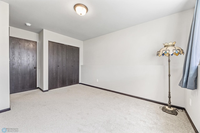 6718 69th Ave S, Horace, ND 58047 - unfurnished bedroom featuring carpet flooring and baseboards