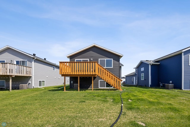 6718 69th Ave S, Horace, ND 58047 - rear view of house with a deck, stairway, cooling unit, and a lawn