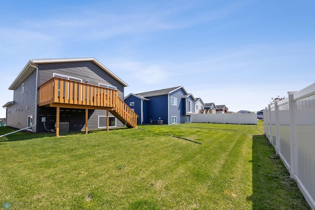 6718 69th Ave S, Horace, ND 58047 - rear view of property featuring a deck, stairway, and central AC unit