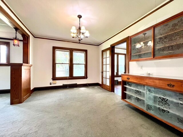 508 2nd Ave, Goodhue, MN 55027 - unfurnished dining area featuring a chandelier, carpet flooring, crown molding, and baseboards