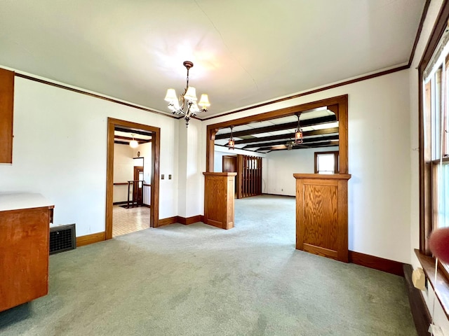 508 2nd Ave, Goodhue, MN 55027 - unfurnished dining area with carpet floors, a chandelier, baseboards, and crown molding