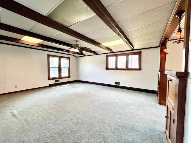 508 2nd Ave, Goodhue, MN 55027 - empty room featuring a ceiling fan, carpet floors, beam ceiling, and baseboards