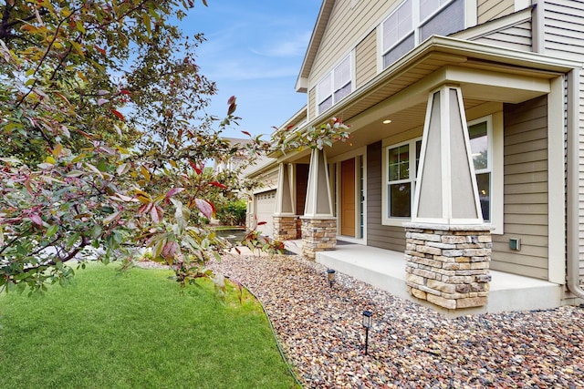 11330 Harness Rd, Woodbury, MN 55129 - view of side of home with a porch, a lawn, and stone siding