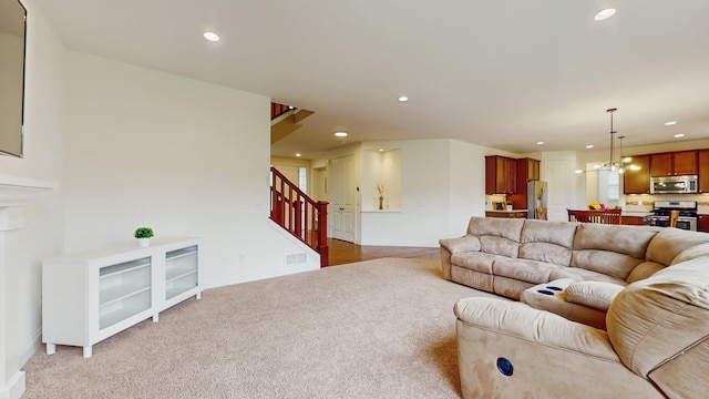 11330 Harness Rd, Woodbury, MN 55129 - carpeted living room featuring stairs, a chandelier, recessed lighting, and baseboards