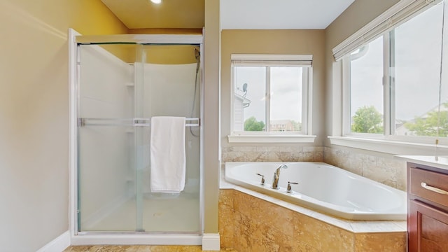 11330 Harness Rd, Woodbury, MN 55129 - bathroom featuring a stall shower, a garden tub, and vanity