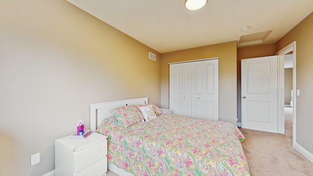 11330 Harness Rd, Woodbury, MN 55129 - bedroom with light colored carpet, a closet, and baseboards