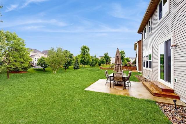 11330 Harness Rd, Woodbury, MN 55129 - view of green lawn featuring a patio