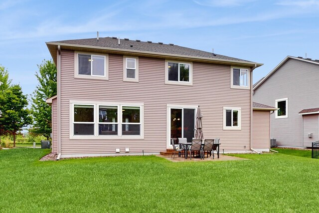 11330 Harness Rd, Woodbury, MN 55129 - rear view of property with a yard, cooling unit, and a patio