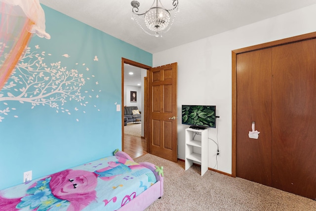 1533 Roundhouse Cir, Shakopee, MN 55379 - bedroom featuring a chandelier, light colored carpet, and baseboards