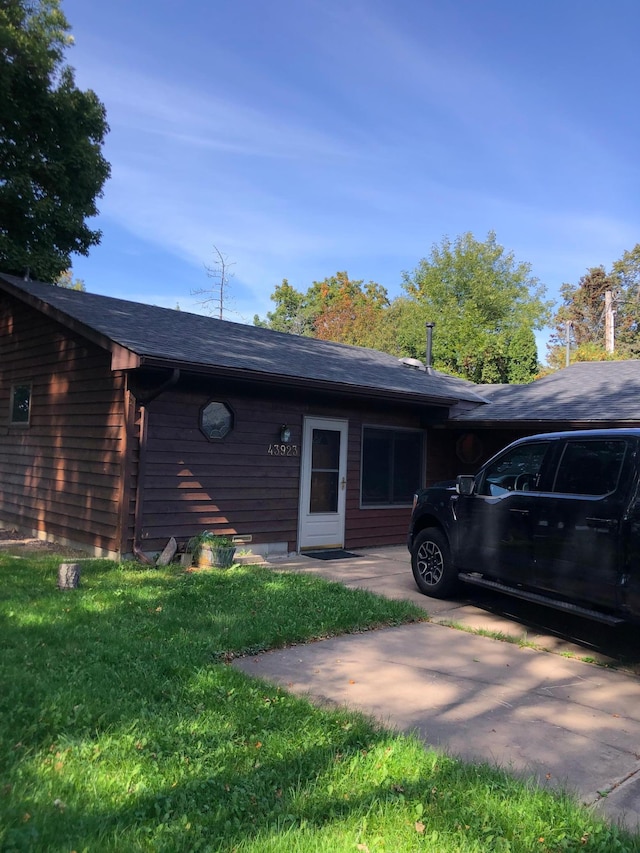 43923 Vista Rd, Isle, MN 56342 - view of side of property with a yard and a shingled roof