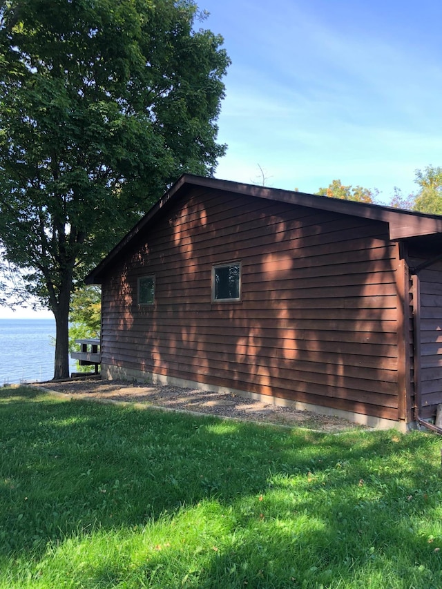 43923 Vista Rd, Isle, MN 56342 - view of side of property featuring a lawn and a water view
