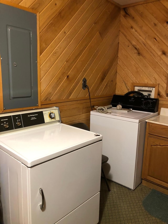 43923 Vista Rd, Isle, MN 56342 - laundry room with electric panel, cabinet space, wooden walls, and washer and dryer