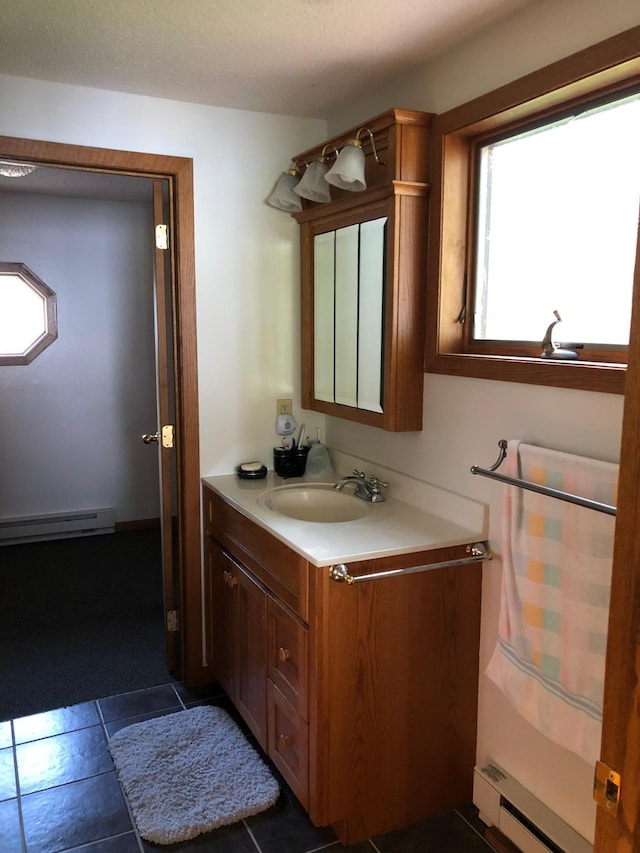 43923 Vista Rd, Isle, MN 56342 - bathroom featuring a baseboard heating unit and vanity