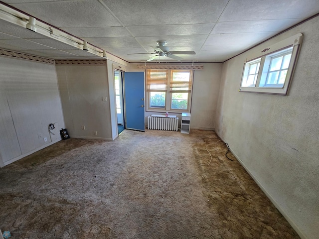 310 20th St N, Fargo, ND 58102 - carpeted spare room featuring radiator, a ceiling fan, and baseboards