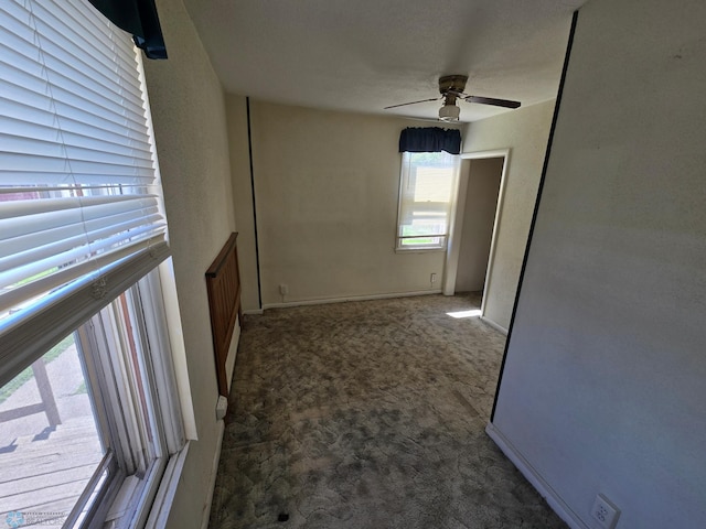 310 20th St N, Fargo, ND 58102 - carpeted spare room featuring a ceiling fan and baseboards