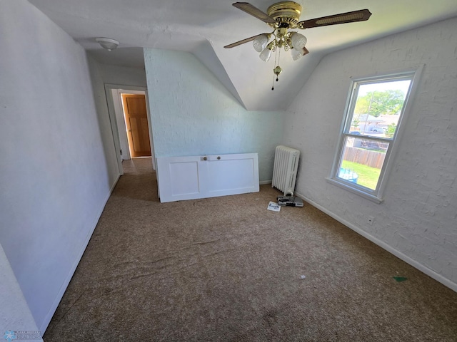 310 20th St N, Fargo, ND 58102 - additional living space with radiator heating unit, vaulted ceiling, a ceiling fan, carpet, and baseboards
