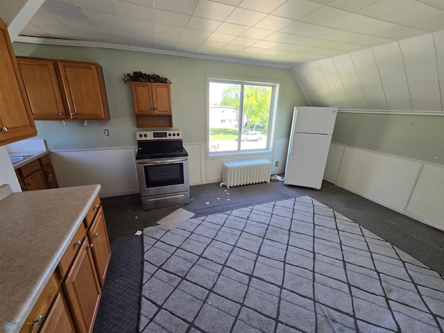310 20th St N, Fargo, ND 58102 - kitchen featuring radiator, stainless steel range with electric cooktop, freestanding refrigerator, brown cabinetry, and carpet floors