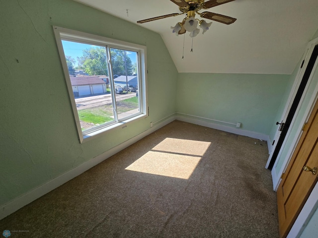 310 20th St N, Fargo, ND 58102 - additional living space with carpet, vaulted ceiling, baseboards, and a ceiling fan